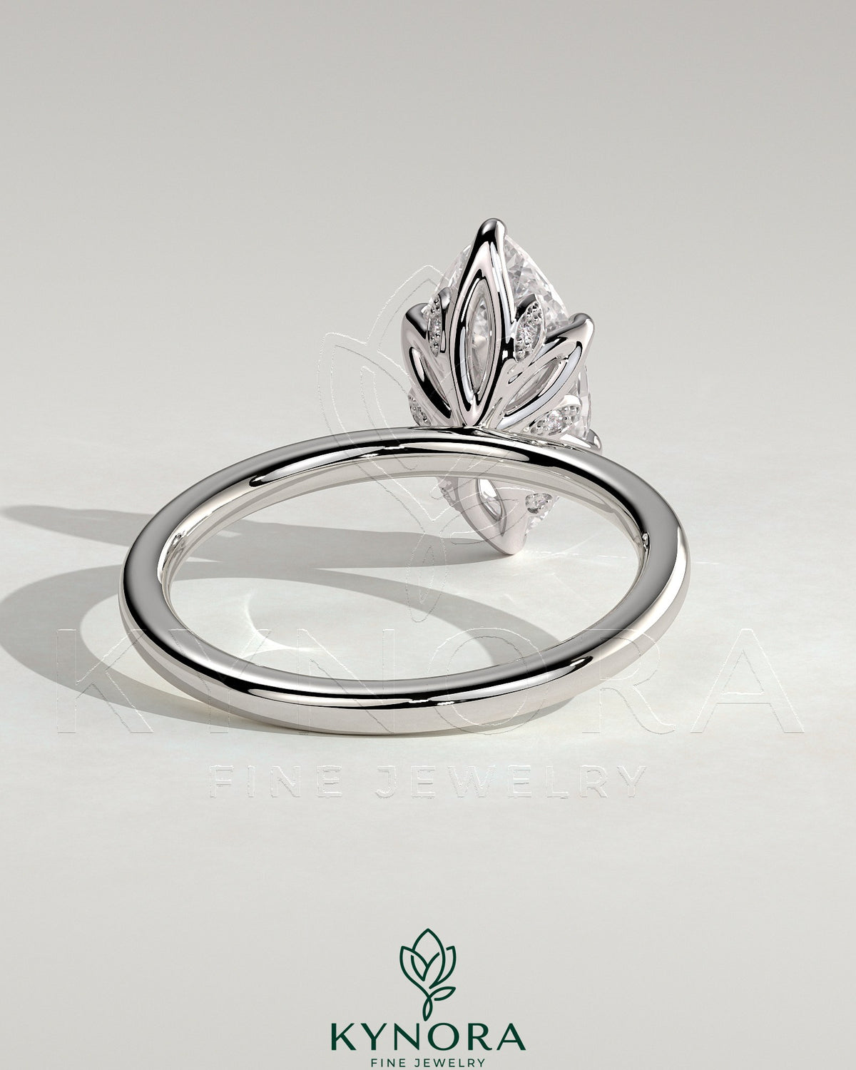 Kynora CJ 2ct marquise claw solitaire engagement ring with petal gallery and leaf accents, elegant and detailed jewelry design.