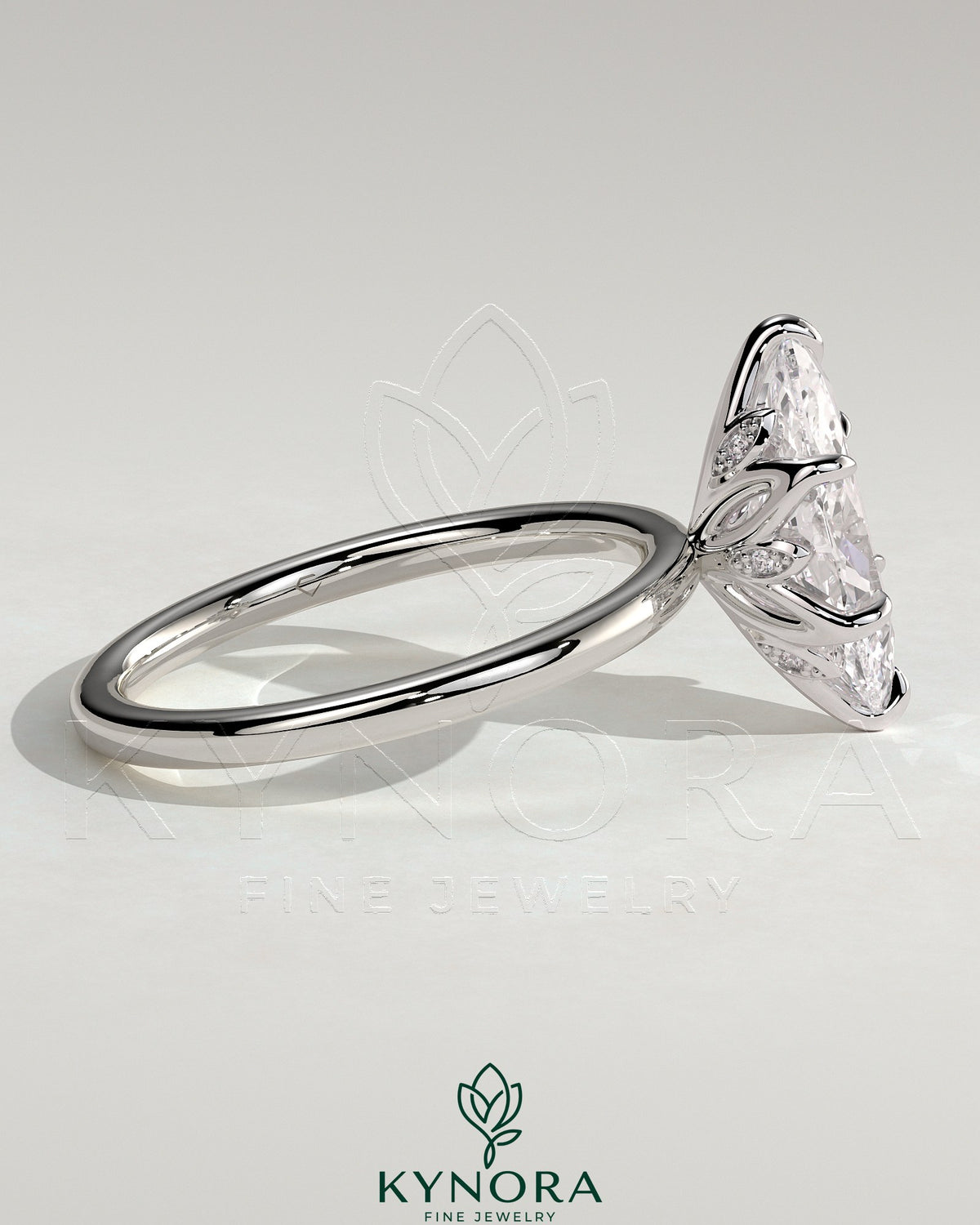 Kynora CJ 2ct marquise claw solitaire engagement ring with petal gallery and accent leaf details, showcasing fine craftsmanship.
