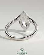 Kynora CJ 2ct marquise claw solitaire engagement ring with V-shaped band showcasing a sparkling marquise diamond.