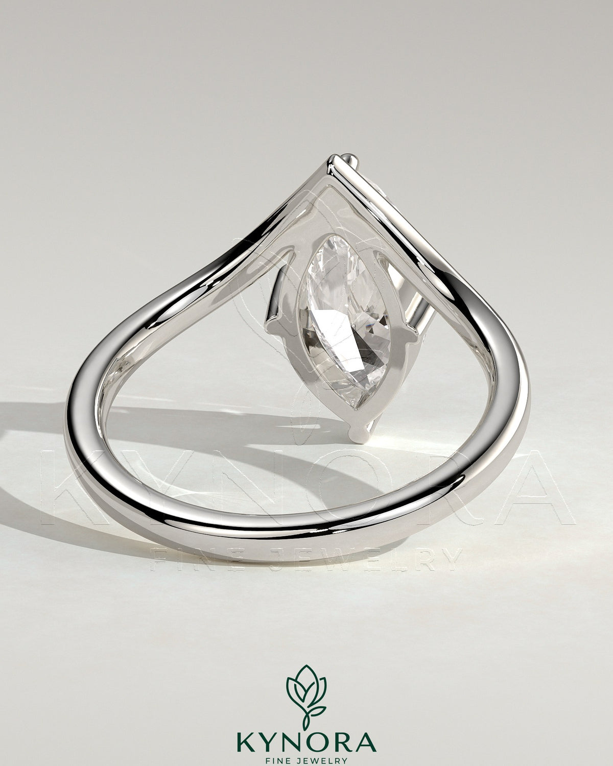 Kynora CJ 2ct marquise claw solitaire engagement ring with V-shaped band showcasing a sparkling marquise diamond.