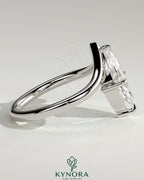 Kynora CJ 2-carat marquise claw solitaire engagement ring with V-shaped band, featuring a sparkling marquise cut diamond.
