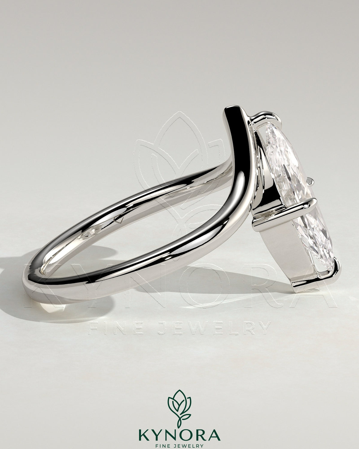 Kynora CJ 2-carat marquise claw solitaire engagement ring with V-shaped band, featuring a sparkling marquise cut diamond.