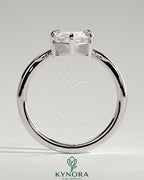 Kynora CJ 2ct marquise claw solitaire engagement ring with V-shaped band, showcasing a sparkling marquise diamond setting.