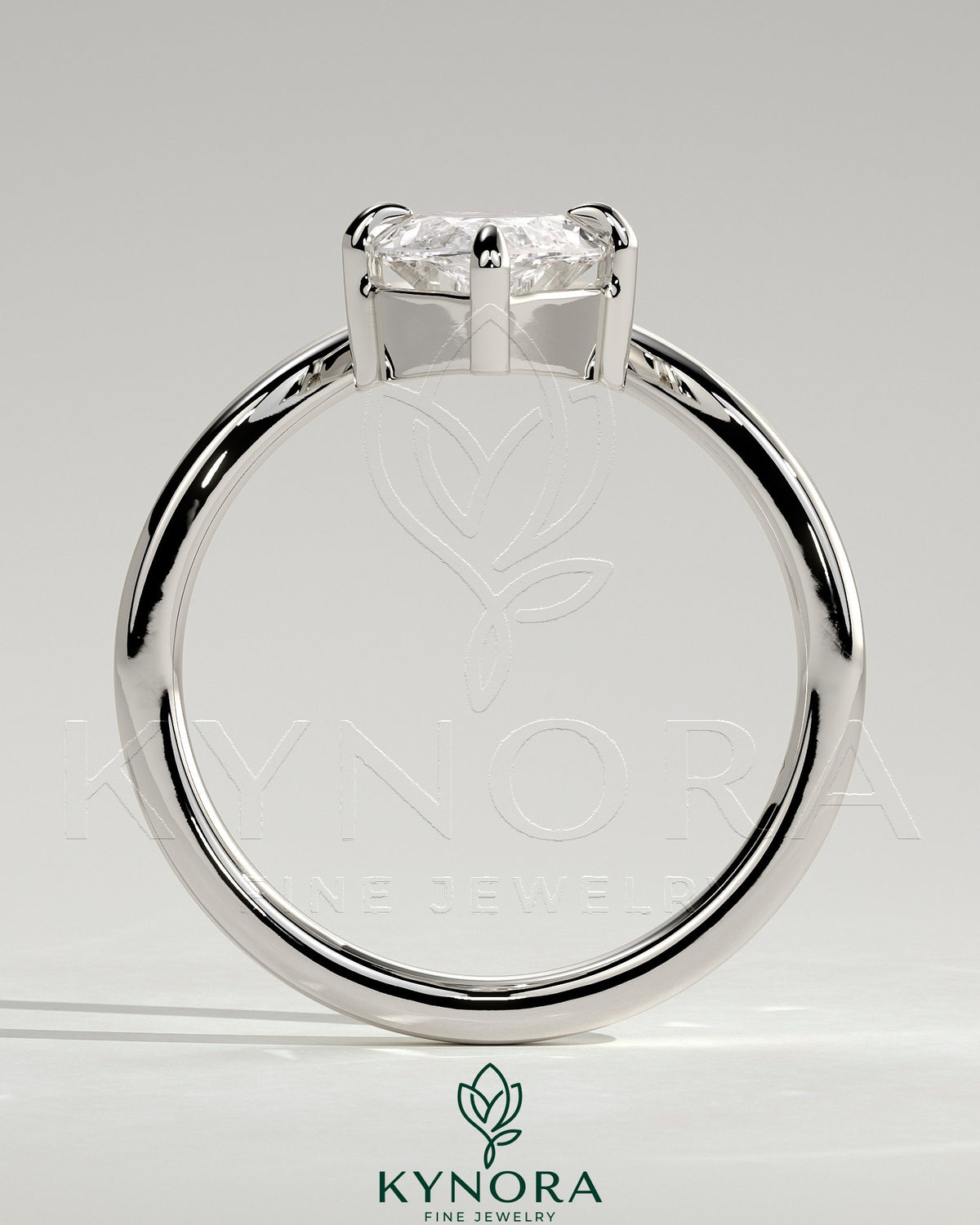 Kynora CJ 2ct marquise claw solitaire engagement ring with V-shaped band, showcasing a sparkling marquise diamond setting.