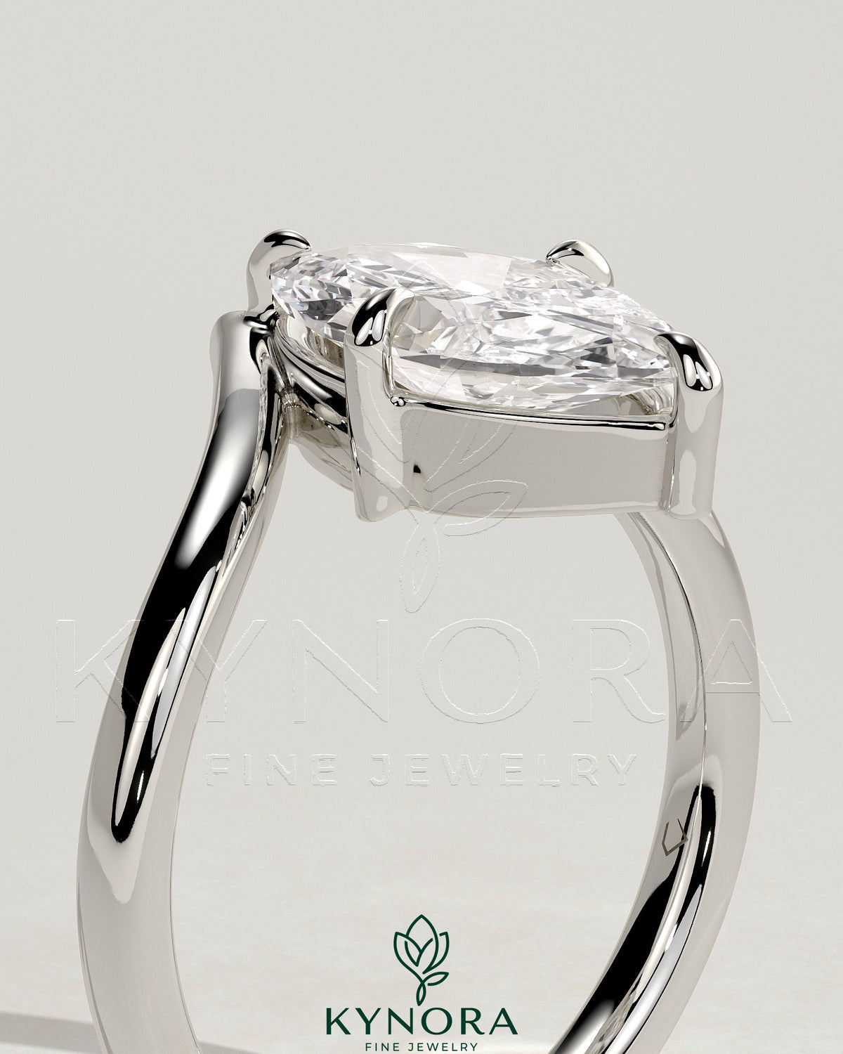 Kynora CJ 2ct marquise claw solitaire engagement ring with V-shaped band, showcasing a sparkling marquise diamond and elegant design.