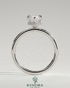 Kynora CJ 2ct marquise claw solitaire engagement ring with a wrap-around hidden halo setting, showcasing fine jewelry craftsmanship.