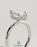 Kynora CJ 2ct marquise claw solitaire engagement ring with wrap-around hidden halo in sterling silver setting.
