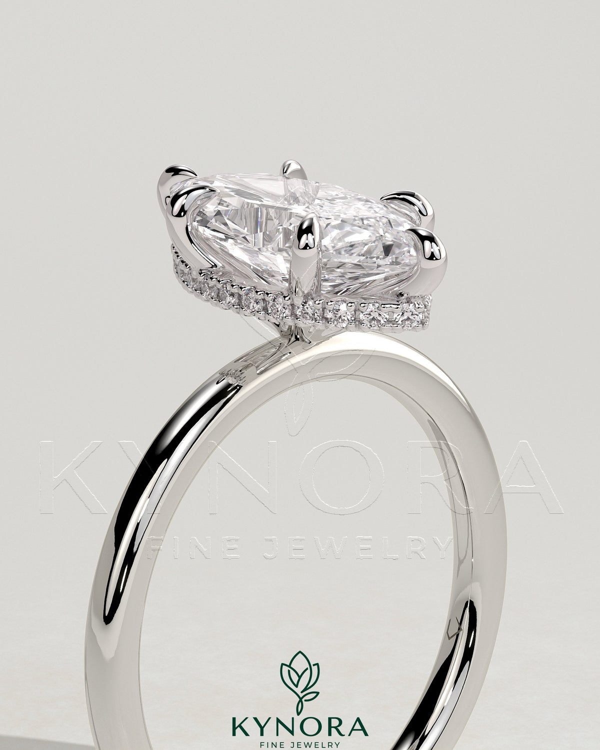 Kynora CJ 2ct marquise claw solitaire engagement ring with wrap-around hidden halo in sterling silver setting.