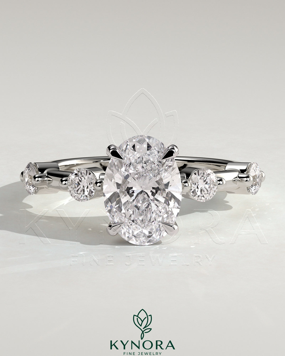 Kynora CJ 2ct oval claw solitaire engagement ring with four round accent stones and a hidden halo design. Main image