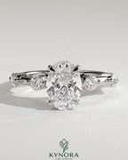 Kynora CJ 2ct oval claw solitaire engagement ring with four round accent stones and a hidden halo design.