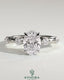 Kynora CJ 2ct oval claw solitaire engagement ring with four round accent stones and a hidden halo design.