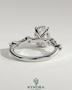 Kynora CJ 2ct oval claw solitaire engagement ring with four round accent stones and hidden halo setting, elegant jewelry design
