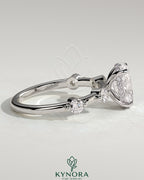 Kynora CJ 2ct oval claw solitaire engagement ring with four round accent stones and hidden halo design.