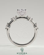 Kynora CJ 2ct oval claw solitaire engagement ring with four round accent stones and a hidden halo design.