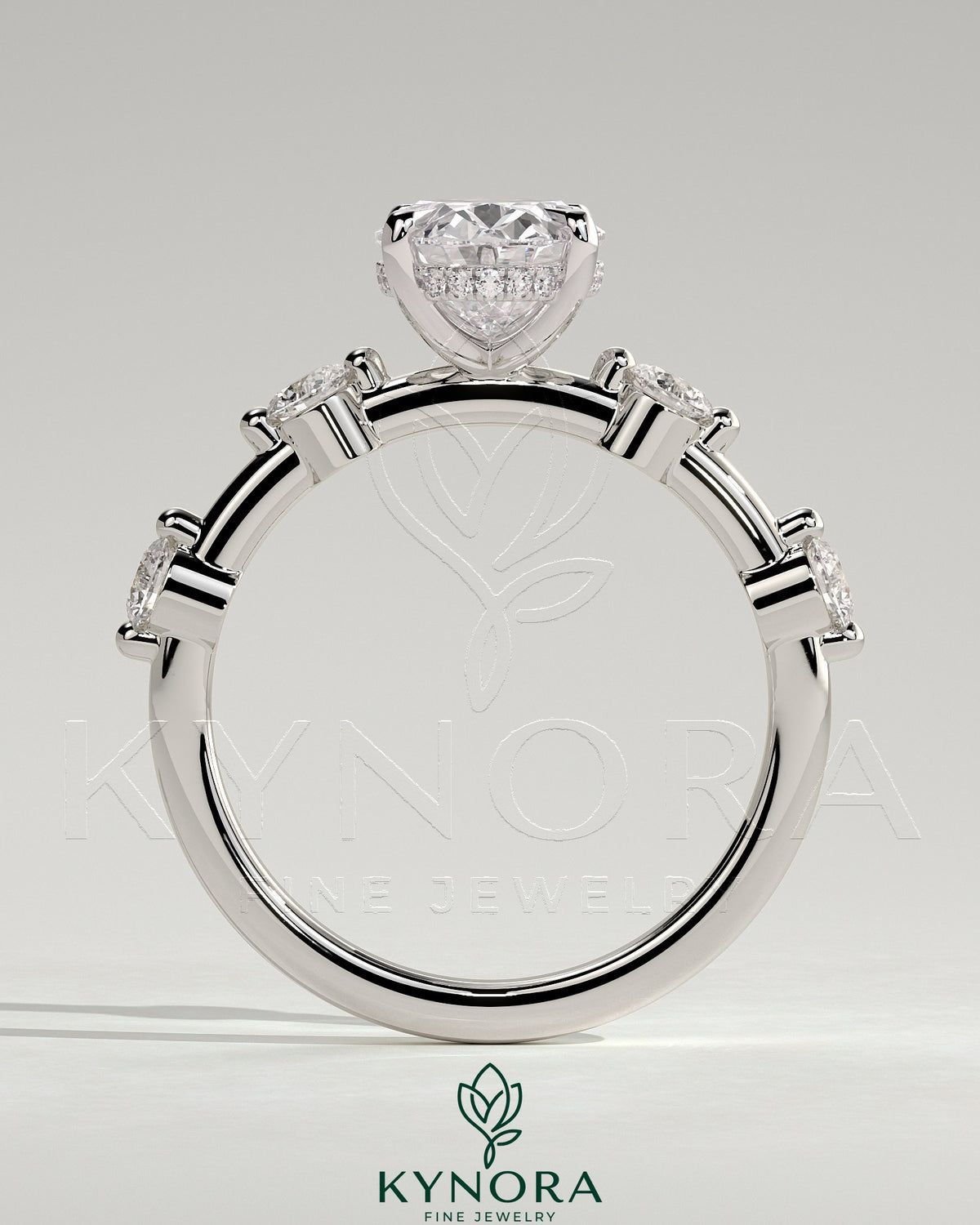 Kynora CJ 2ct oval claw solitaire engagement ring with four round accent stones and a hidden halo design.