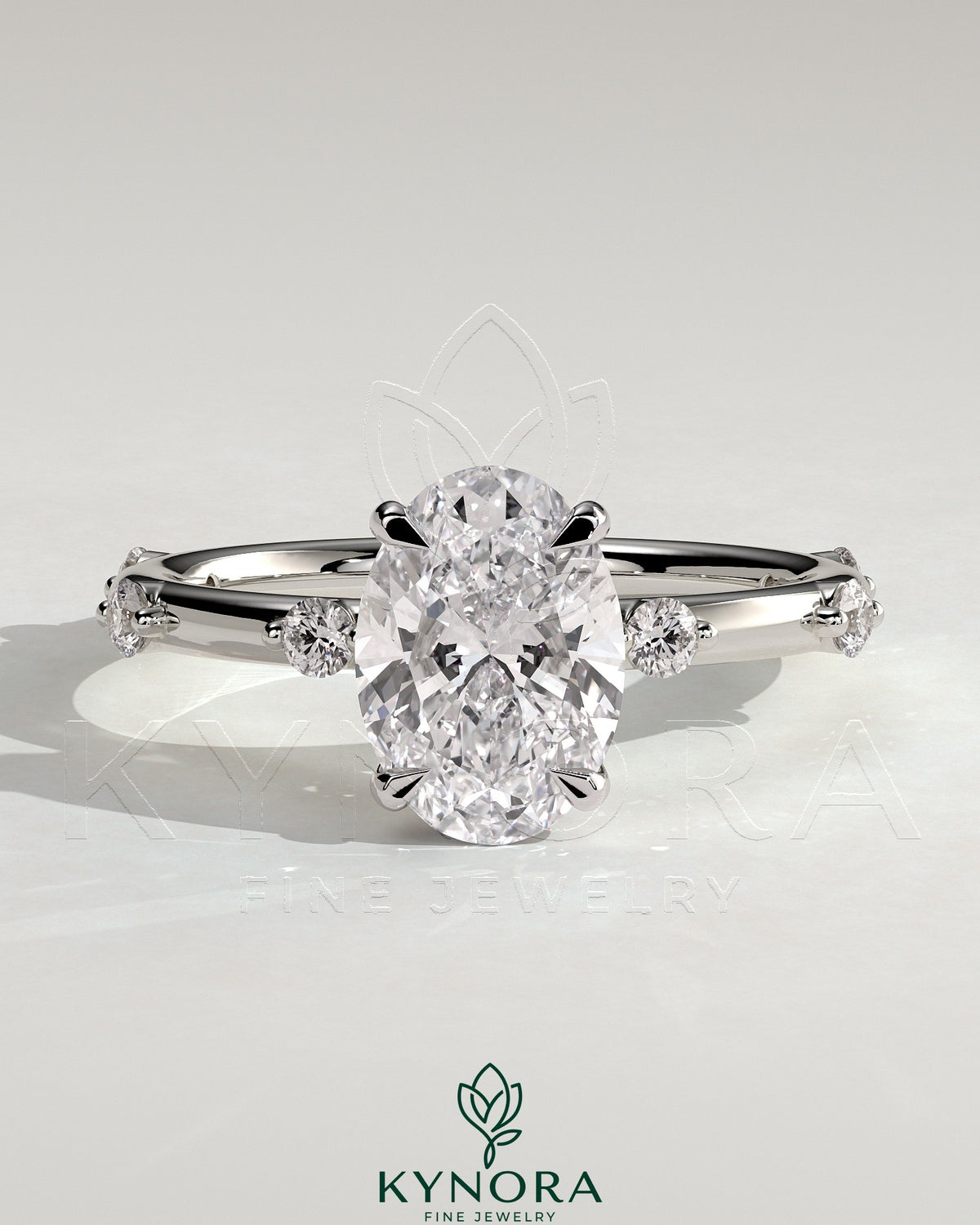 Kynora CJ 2ct oval claw solitaire engagement ring with six accent stones and hidden halo, showcasing sparkling diamond details. Main image