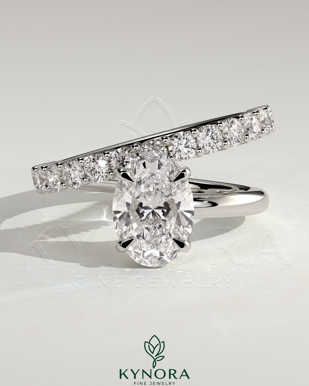 Kynora CJ 2ct oval claw solitaire engagement ring with angled pave band, featuring a sparkling oval diamond and intricate band design. Main image