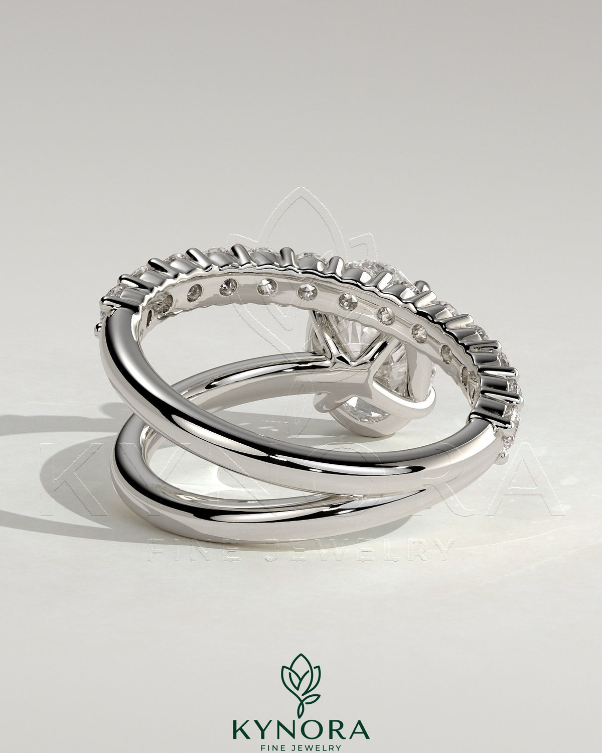 Kynora CJ 2ct oval claw solitaire engagement ring with angled pave band, featuring a stunning oval diamond and elegant design.
