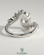 Kynora CJ 2ct oval solitaire engagement ring with bypass band and clustered round-marquise accent stones in 14k gold