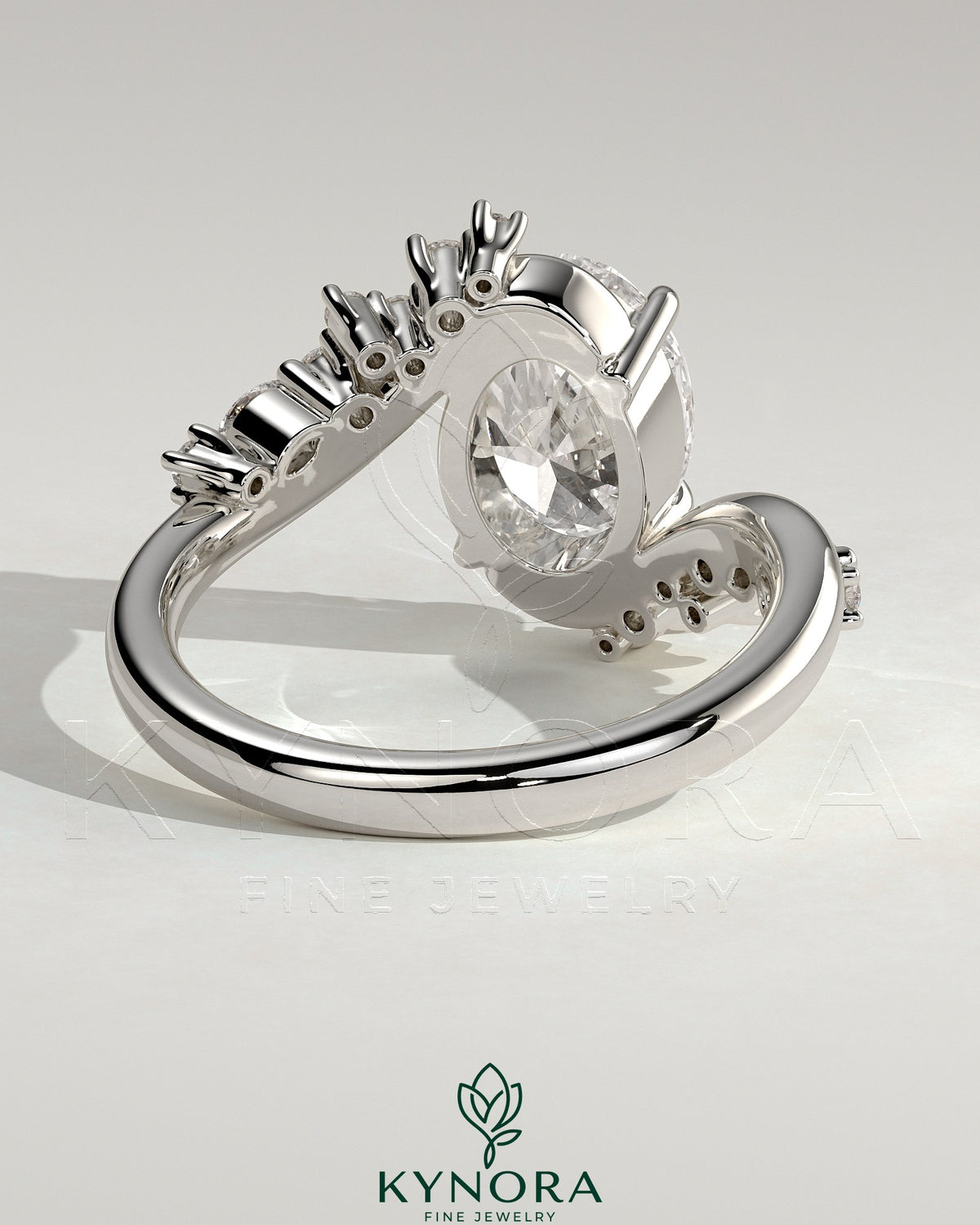 Kynora CJ 2ct oval solitaire engagement ring with bypass band and clustered round-marquise accent stones in 14k gold