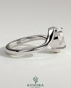 Kynora CJ 2-carat oval claw solitaire engagement ring with bypass band, showcasing a sparkling diamond and elegant design