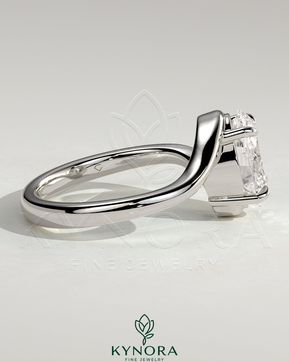 Kynora CJ 2-carat oval claw solitaire engagement ring with bypass band, showcasing a sparkling diamond and elegant design