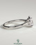 Kynora CJ 2ct oval claw solitaire engagement ring with cathedral high setting, featuring a prominent oval diamond on a sleek band.