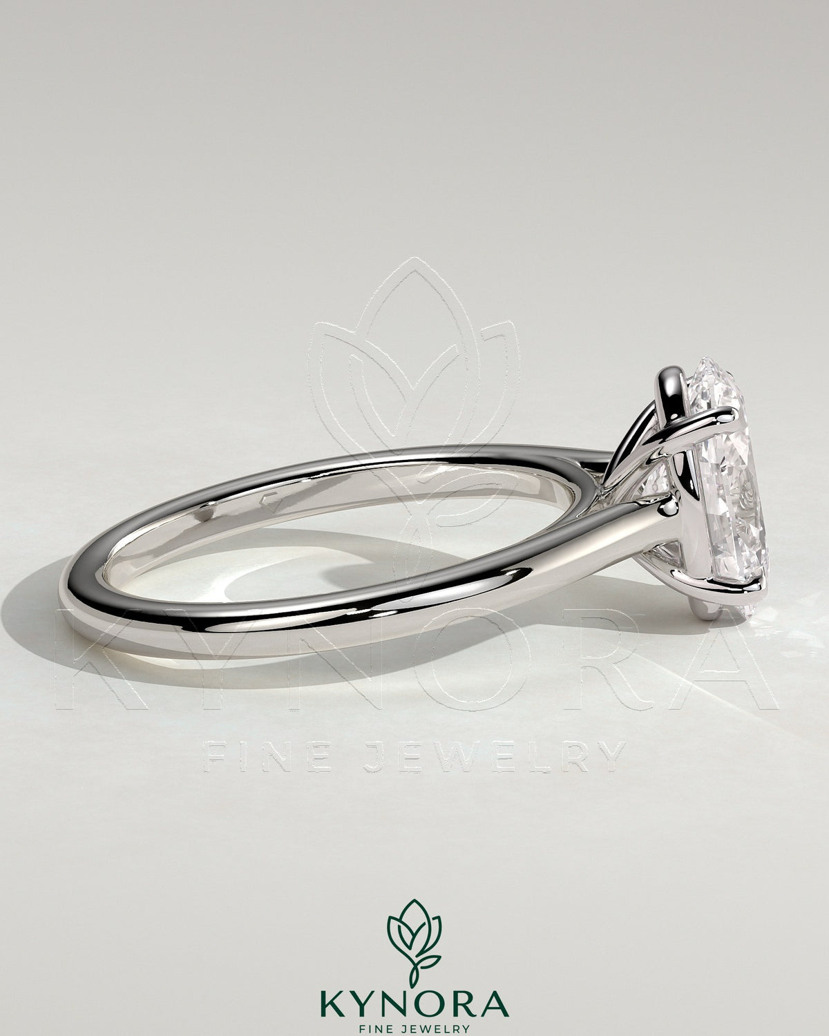 Kynora CJ 2ct oval claw solitaire engagement ring with cathedral high setting, featuring a prominent oval diamond on a sleek band.