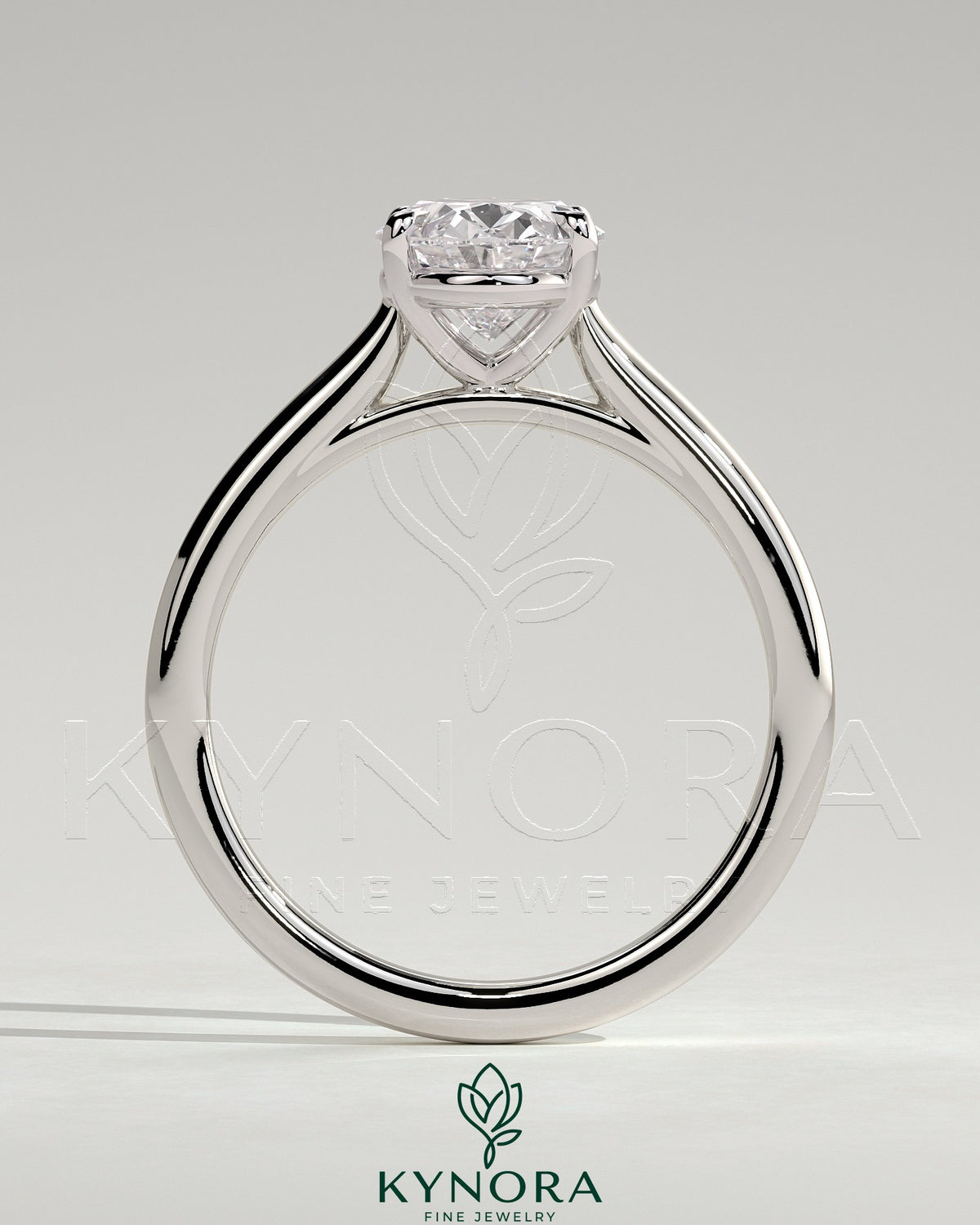 Kynora CJ 2ct oval claw solitaire engagement ring with cathedral high setting, showcasing a sparkling oval diamond on a sleek band.