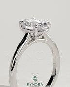 Kynora CJ 2ct oval claw solitaire engagement ring with cathedral high setting showcasing the sparkling center stone and elegant band.