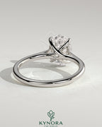 Kynora CJ 2ct oval claw solitaire engagement ring with cathedral low setting and open trellis gallery design.
