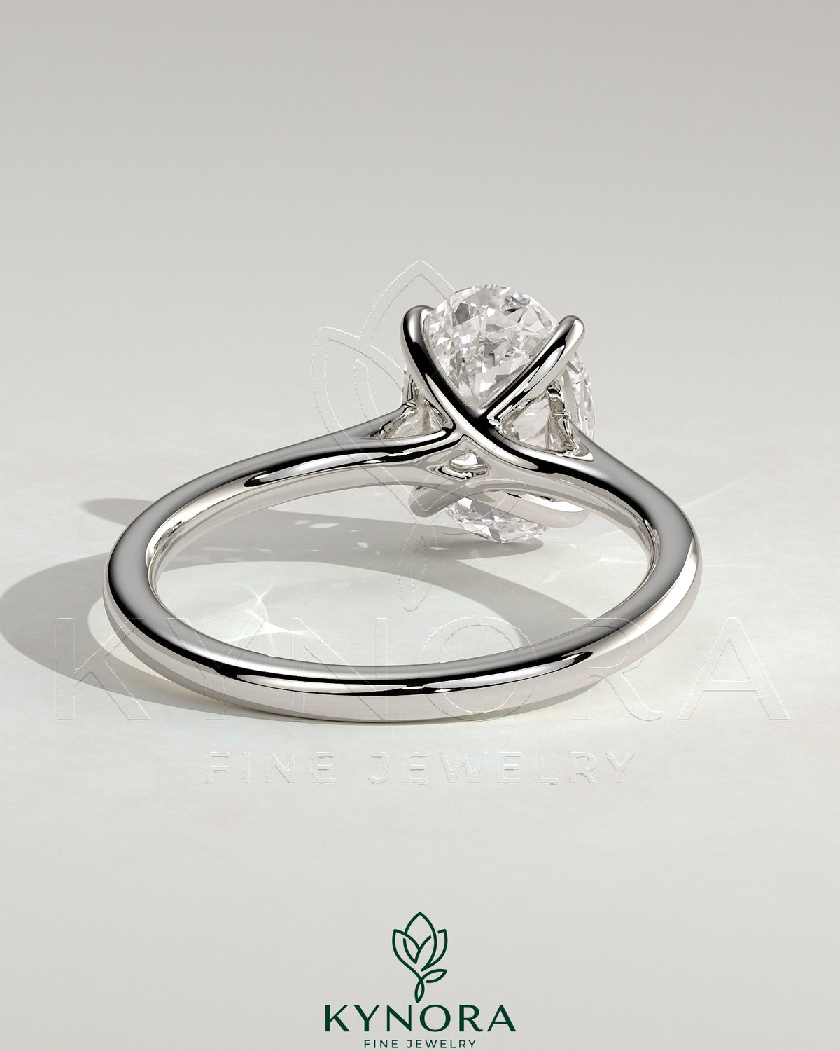 Kynora CJ 2ct oval claw solitaire engagement ring with cathedral low setting and open trellis gallery design.