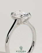 Kynora CJ 2ct oval claw solitaire engagement ring with cathedral low setting and open trellis gallery design.