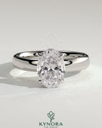 Kynora CJ 2ct oval claw solitaire engagement ring with cigar band and hidden halo showcasing sparkling diamond design.
