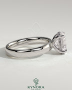 Kynora CJ 2ct oval claw solitaire engagement ring with cigar band and hidden halo, showcasing a sparkling diamond setting.