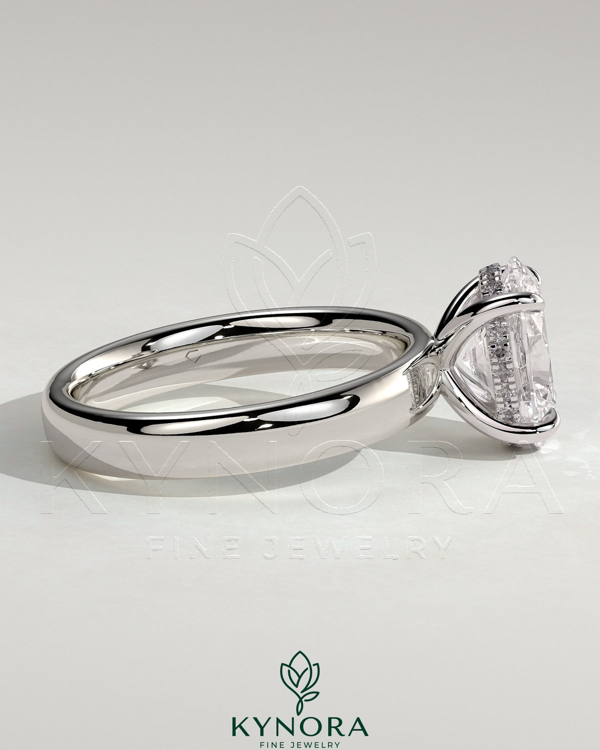 Kynora CJ 2ct oval claw solitaire engagement ring with cigar band and hidden halo, showcasing a sparkling diamond setting.