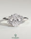 Kynora CJ 2ct oval claw solitaire engagement ring with clustered round shoulder stones and sleek band design.