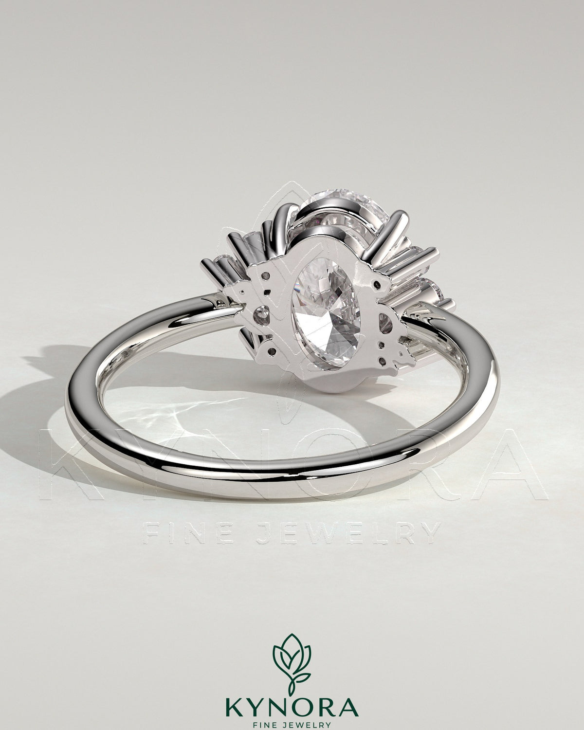 Kynora CJ 2ct oval claw solitaire engagement ring with clustered round shoulder stones, elegant and sparkling jewelry piece