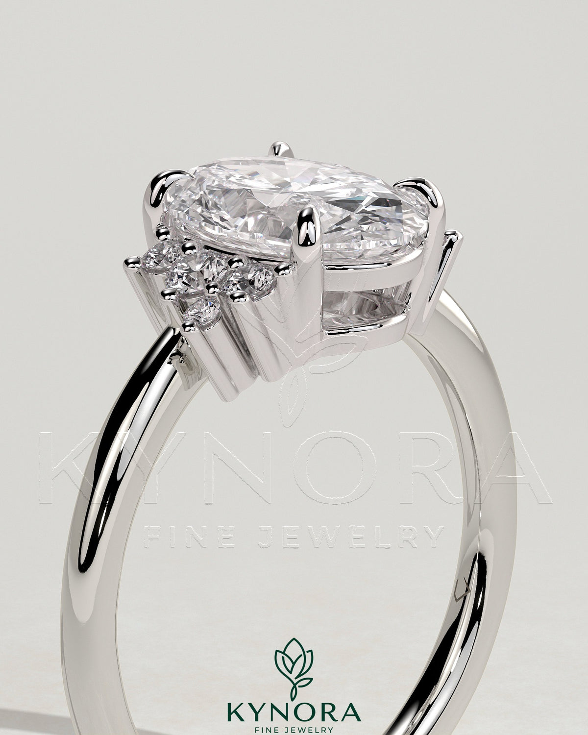 Kynora CJ 2ct oval claw solitaire engagement ring with clustered round shoulder stones, elegant and sparkling jewelry design.