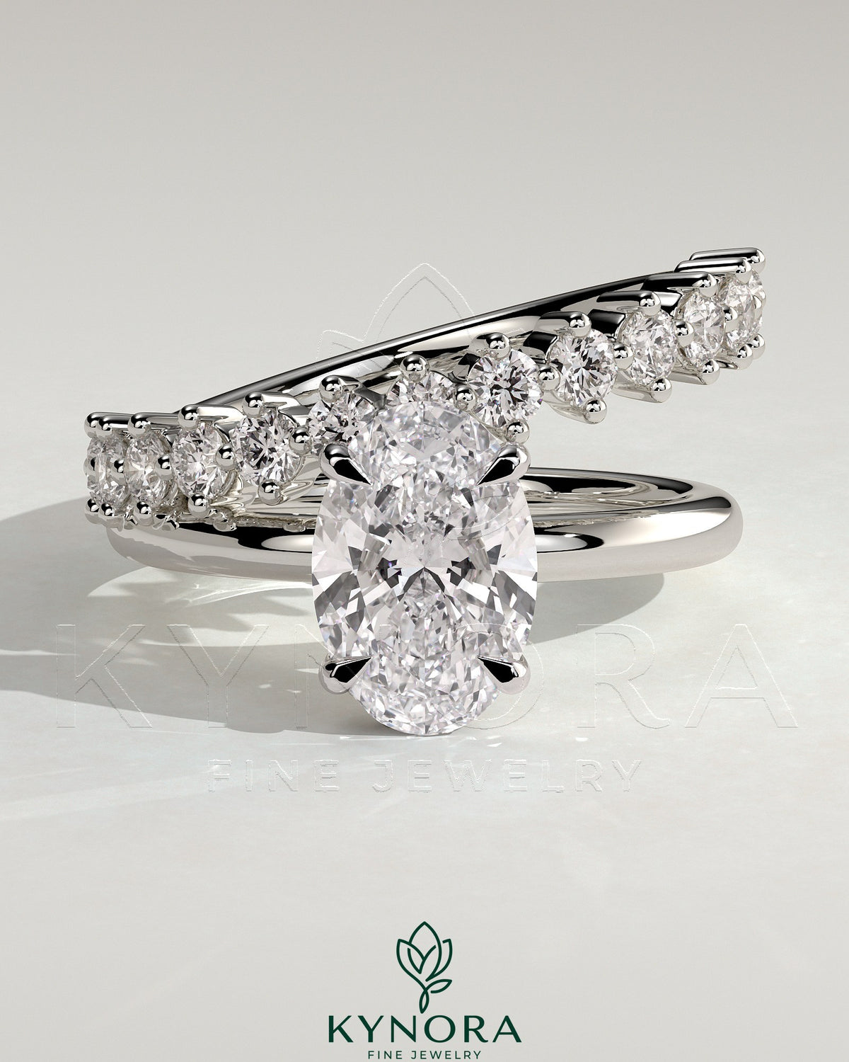 Kynora CJ 2-carat oval claw solitaire engagement ring with double plain and round accent stones band, crafted in elegant jewelry style.