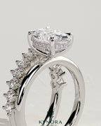 Kynora CJ 2ct oval claw solitaire engagement ring with double plain and round accent stones in a sleek band.