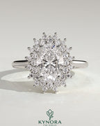 Kynora CJ 2ct oval claw solitaire engagement ring with double sunburst halo and cathedral high setting, showcasing intricate design.