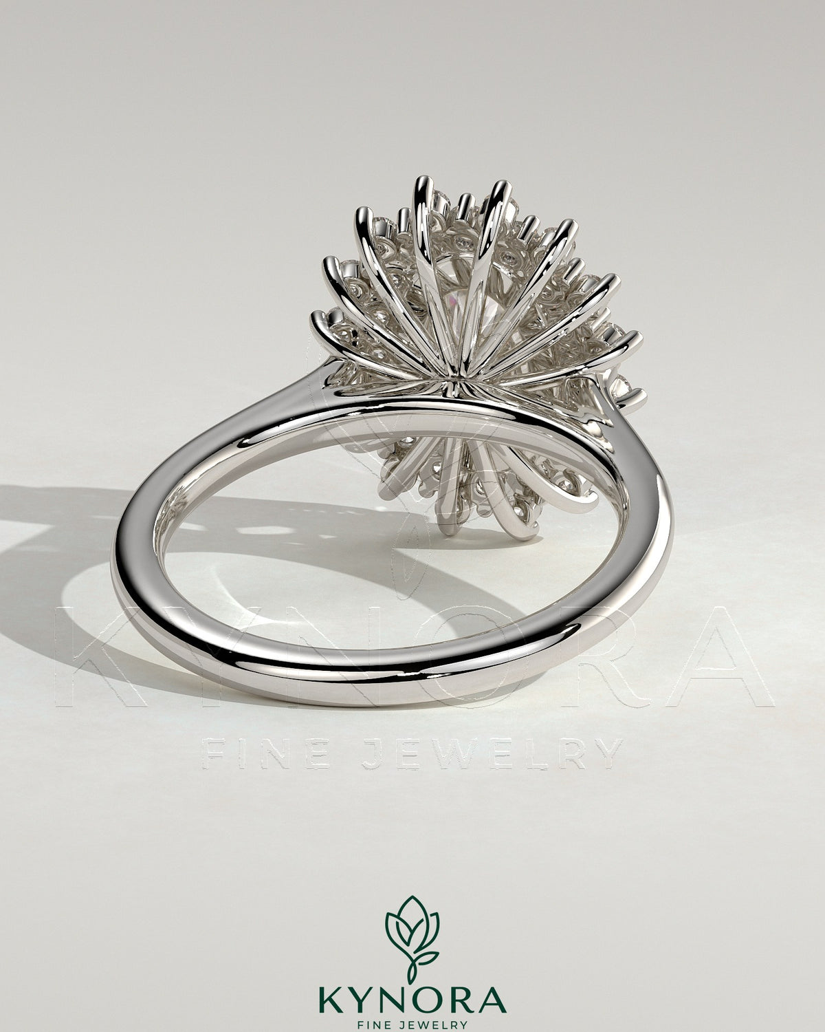 Kynora CJ 2ct oval claw solitaire engagement ring with double sunburst halo and cathedral high setting.