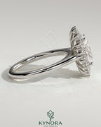 Kynora CJ 2ct oval claw solitaire engagement ring with double sunburst halo and cathedral high setting, showcasing intricate design.