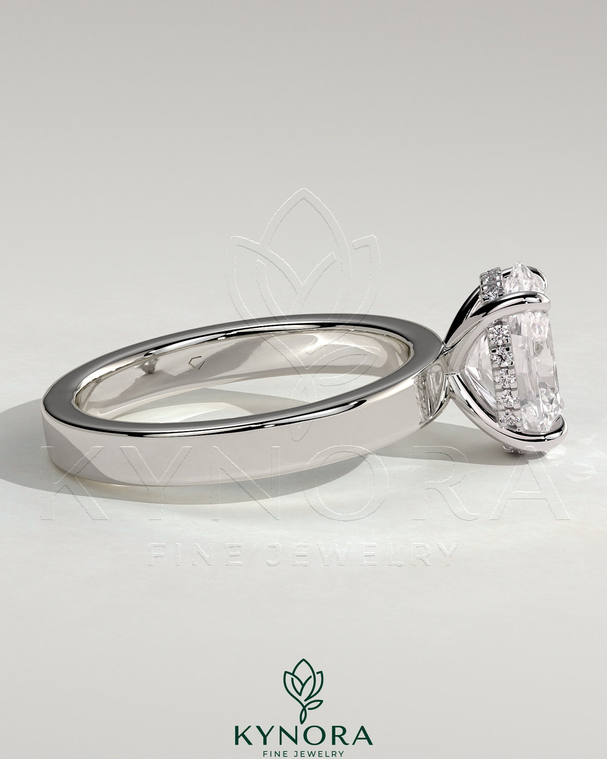 Kynora CJ 2ct oval claw solitaire engagement ring with flat cigar band and hidden halo, showcasing elegant diamond setting.