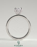 Kynora CJ 2ct oval claw solitaire engagement ring with flat cigar band and hidden halo, showcasing elegant diamond setting.
