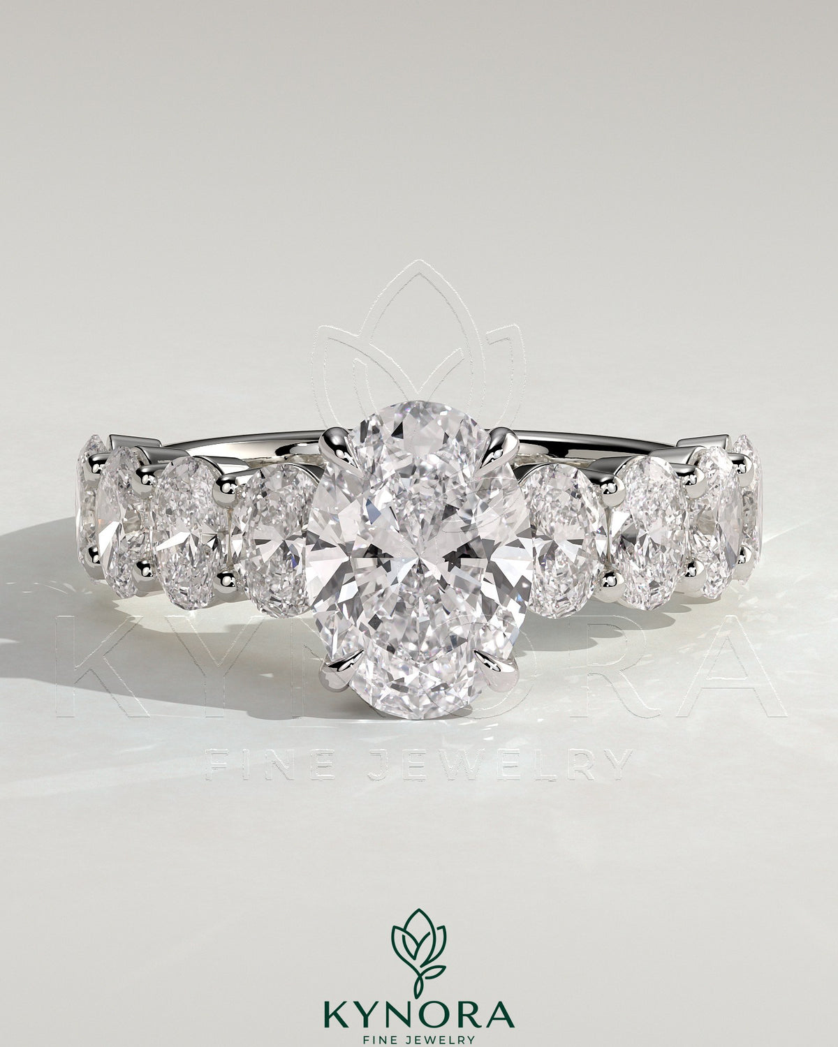 Kynora CJ 2ct oval claw solitaire engagement ring with half eternity oval band and hidden halo, featuring sparkling diamond accents. Main image