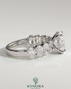 Kynora CJ 2-carat oval claw solitaire engagement ring with half eternity band and hidden halo, elegant and sparkling jewelry.