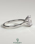 Kynora CJ 2ct oval claw solitaire engagement ring with hidden halo and cathedral high setting, showcasing sparkling diamond details.