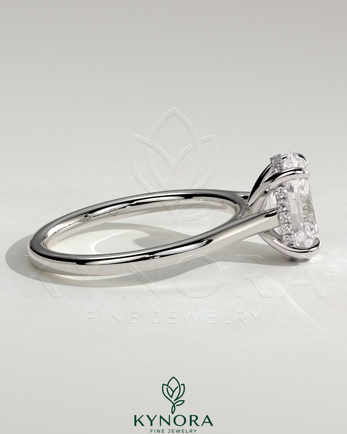 Kynora CJ 2ct oval claw solitaire engagement ring with hidden halo and cathedral high setting, showcasing sparkling diamond details.